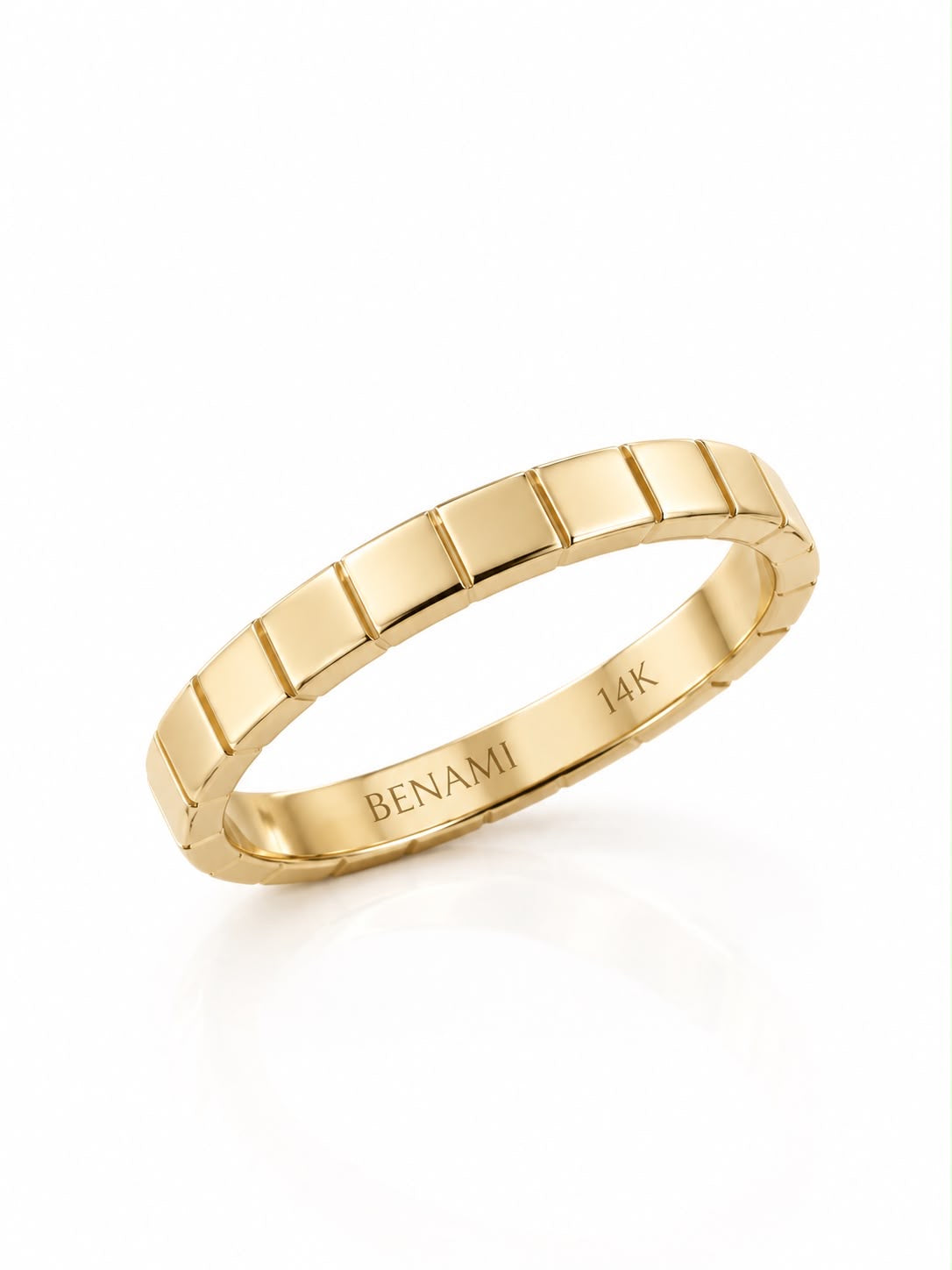 A gold band ring with a raised geometric segmented pattern, featuring 'BENAMI' and '14K' engraved inside the band, shown on a clean white background.